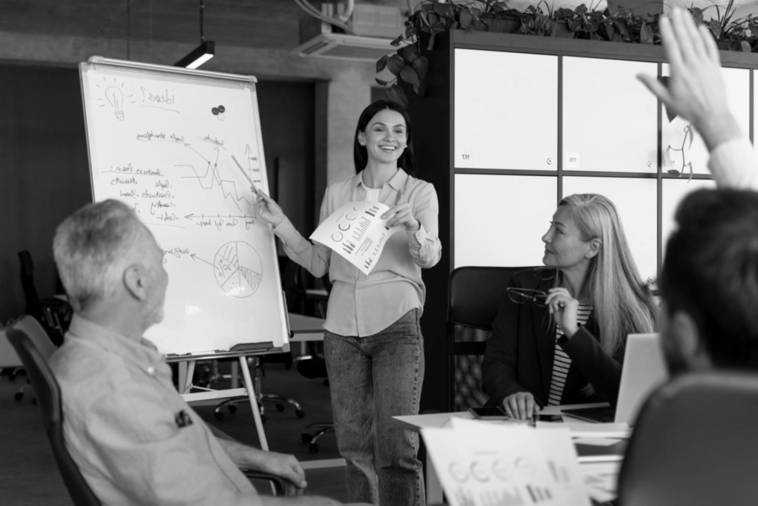 Successful business meeting with team reviewing growth charts
